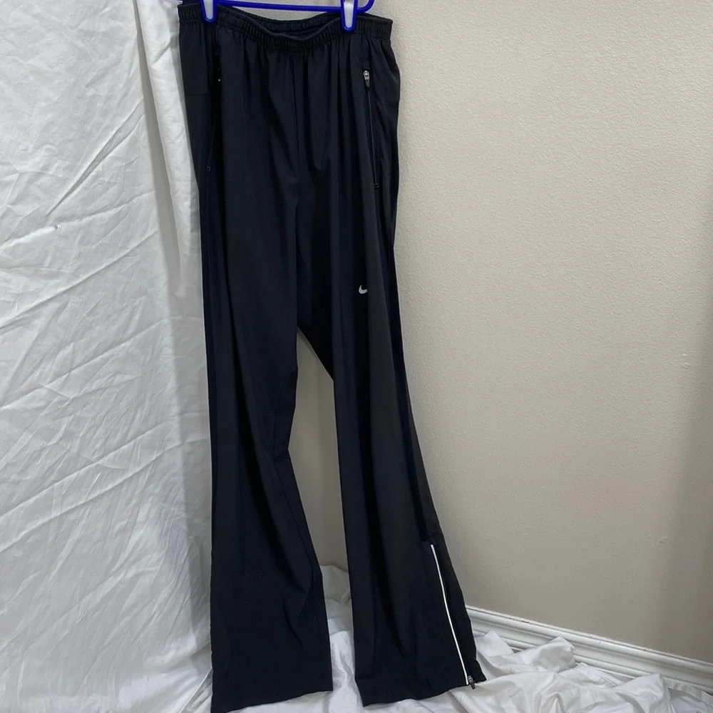 Nike Men’s Dri-Fit black running joggers. Size small.